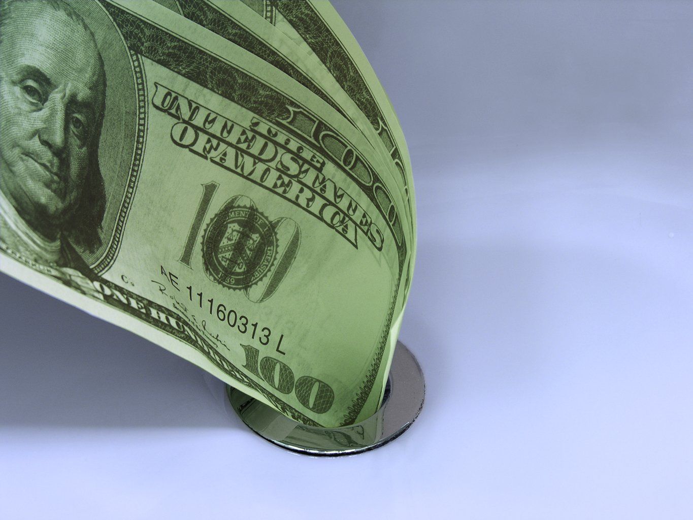 money_down_the_drain.jpg